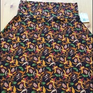 Maxi skirt, silky deep green with mustard flowers.